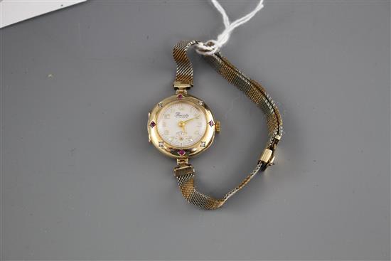 A ladys mid 20th century 14k, ruby and diamond set Precista manual wind dress wrist watch, on rolled gold and steel bracelet.